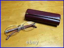 Cartier wood frame glasses with case