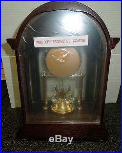 Seiko Mantel Clock In Wooden Case With 3 Rotating Swarovski Crystals Qxn224blh