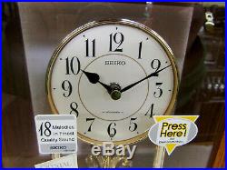 Seiko Mantel Clock In Wooden Case With 3 Rotating Swarovski Crystals Qxw230blh